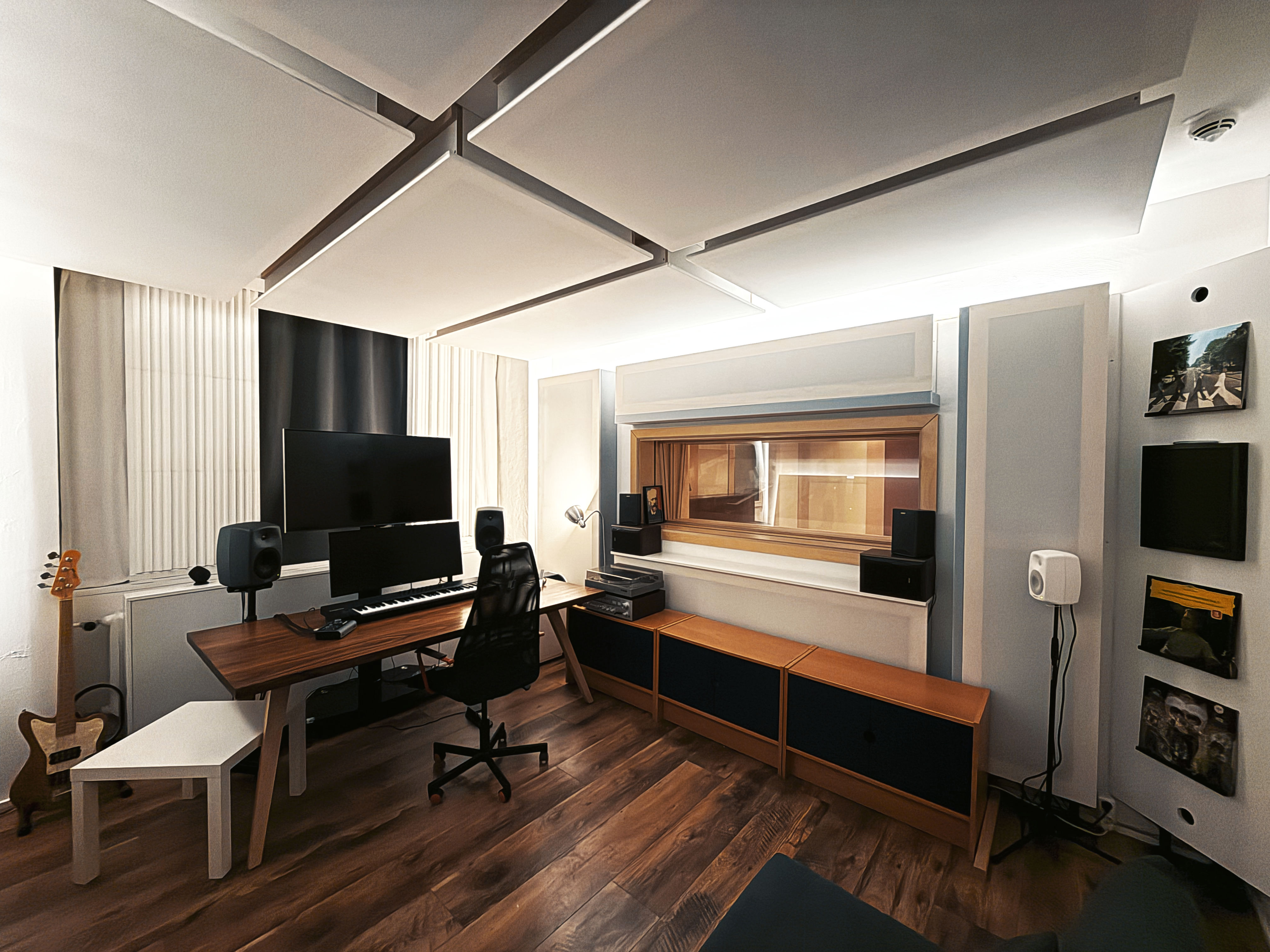 Resonance Studio Berlin control room with studio monitors, acoustic ceiling panels, mixing desk, and window looking into the live recording room