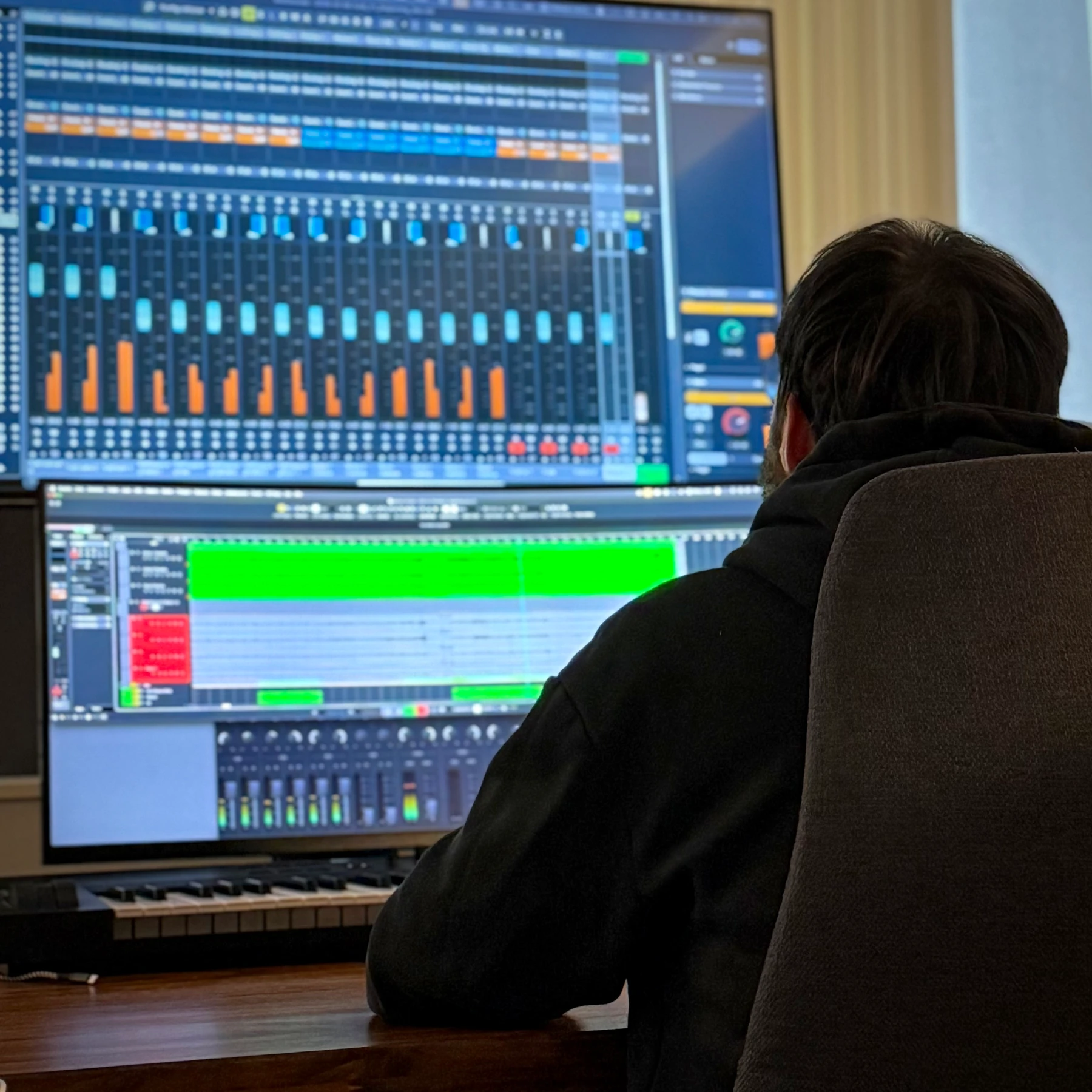 Engineer at the DAW during a mixing session